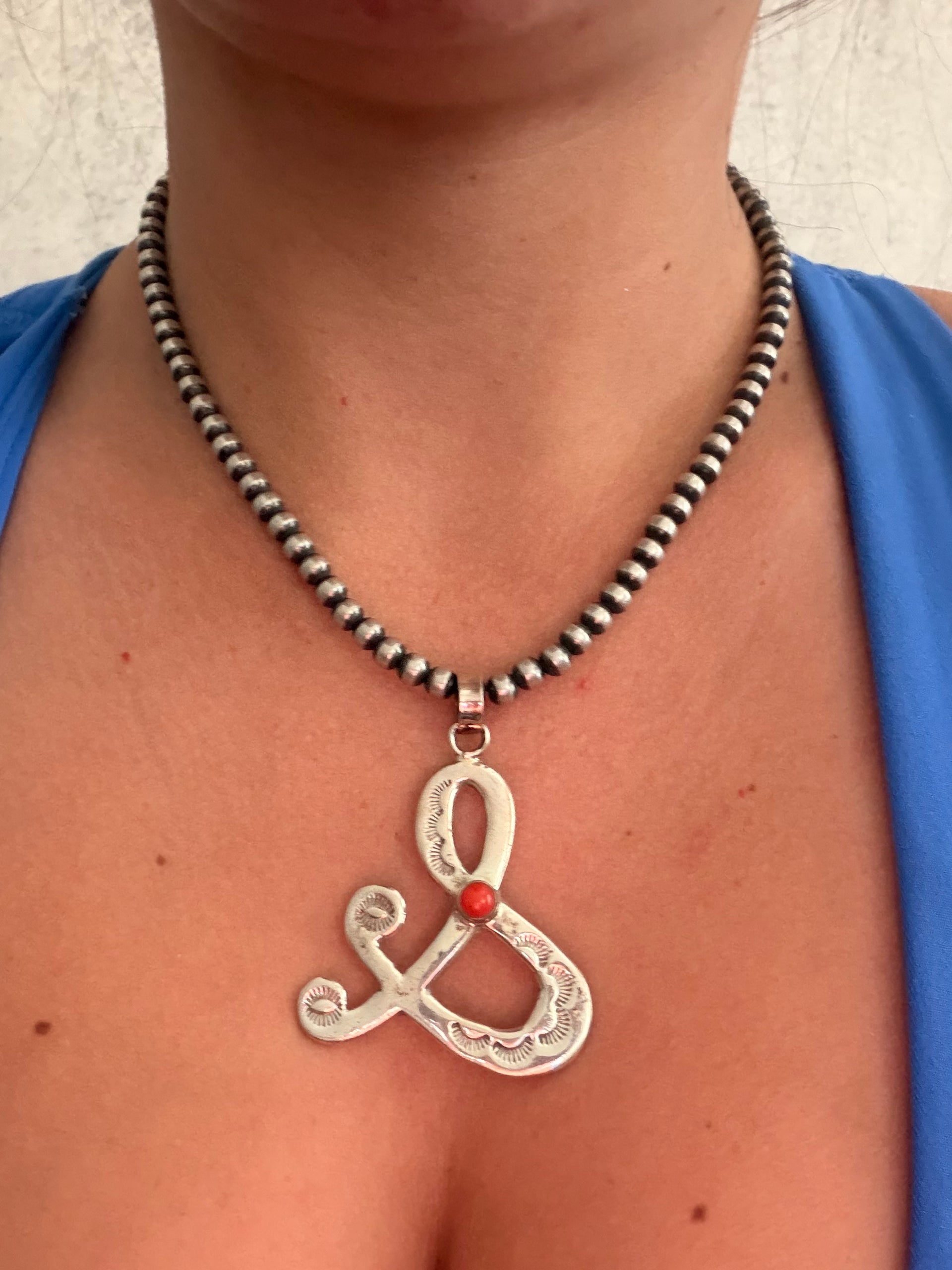 Navajo Made Coral & Sterling Silver Pendant