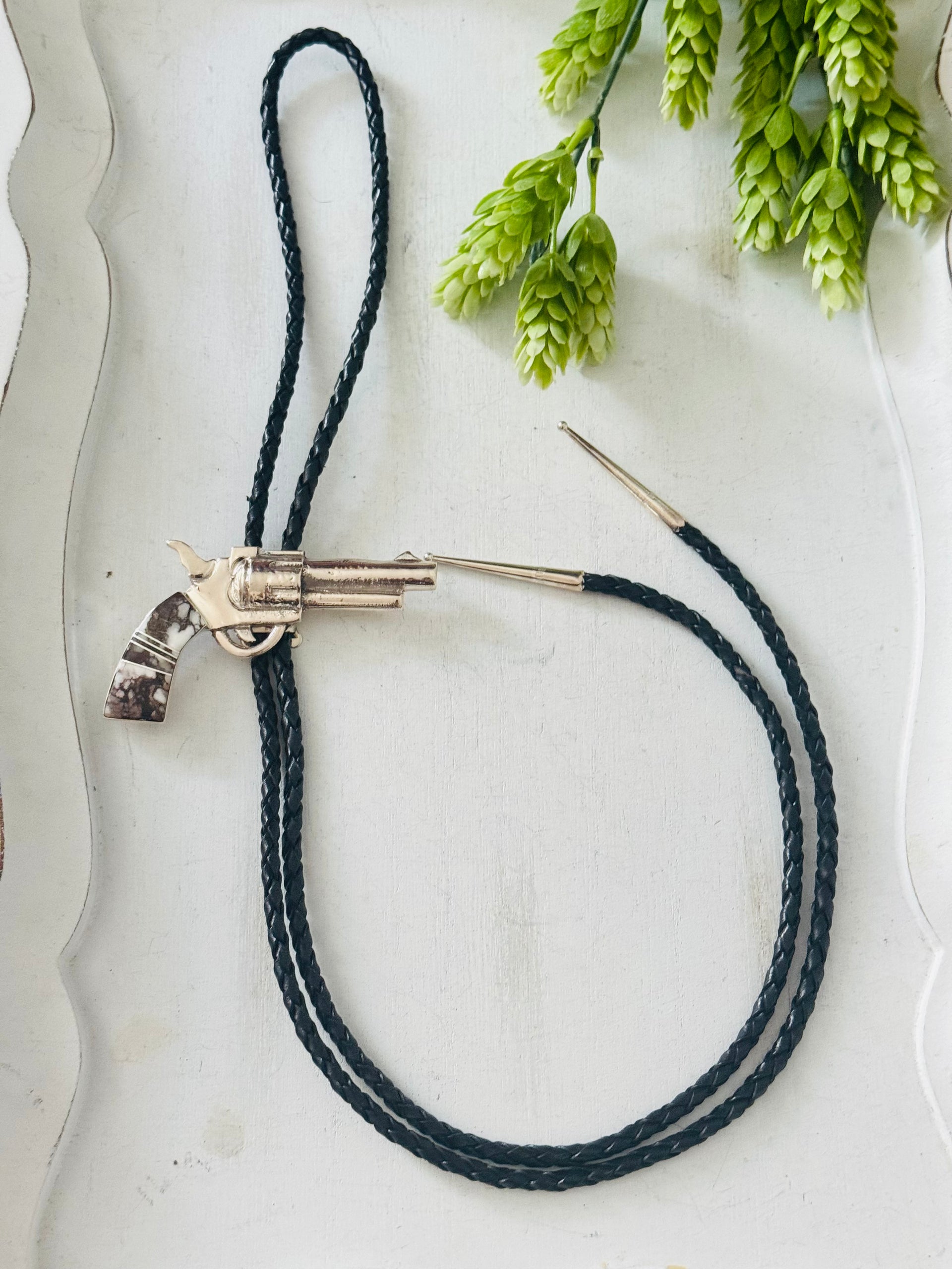 Bobby Mannelito Wild Horse & Sterling Silver Pistol Inlay Bolo Tie