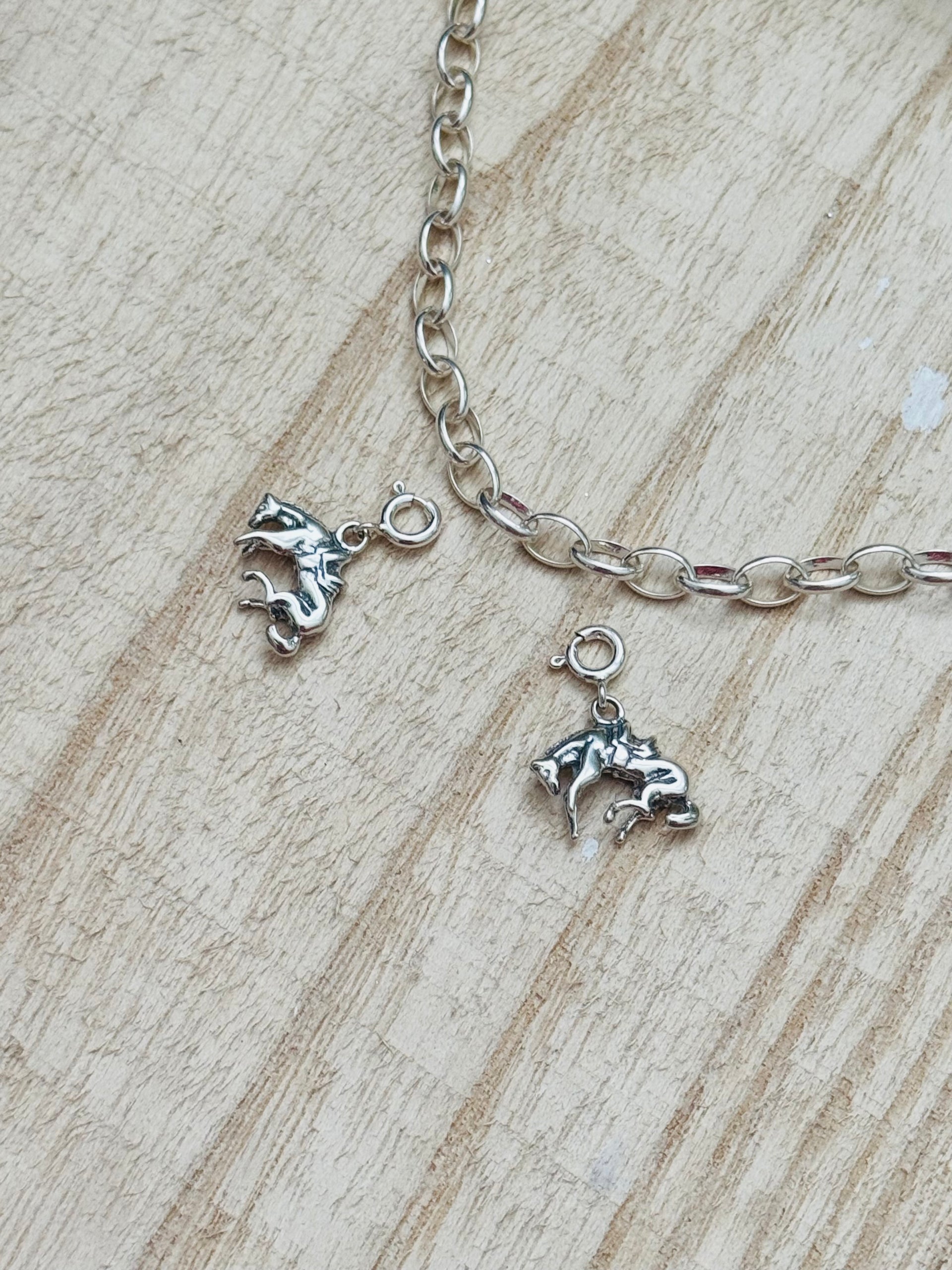 Navajo Made Sterling Silver Bucking Horse Cast Charms